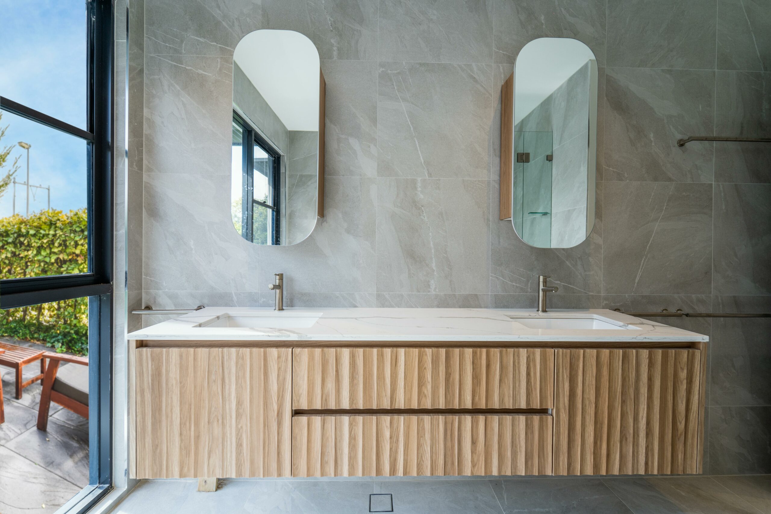 Custom mocha fluted bathroom vanity with undermount basins by Renolux Sydney