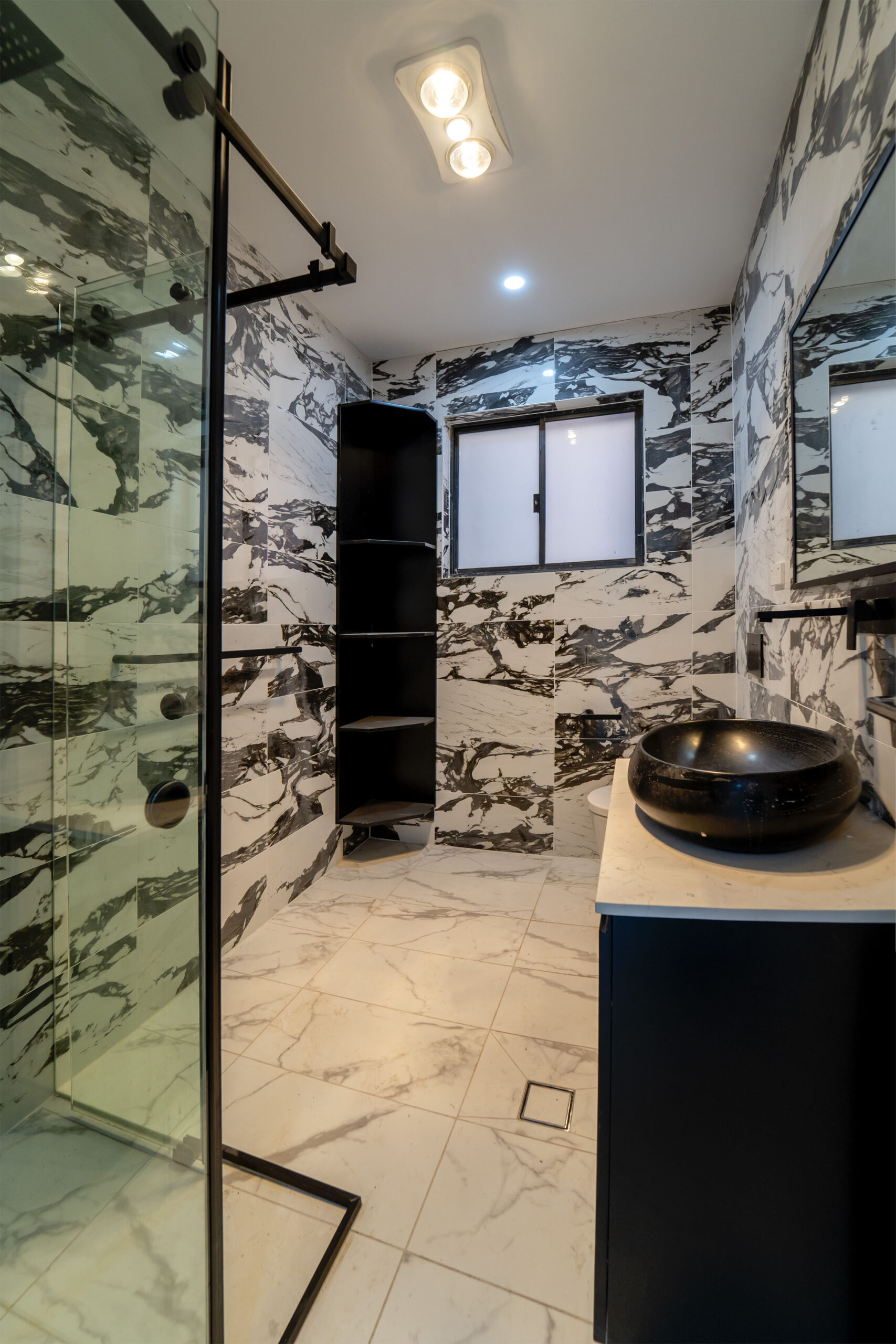 Flat black custom bathroom vanity with top mount basin