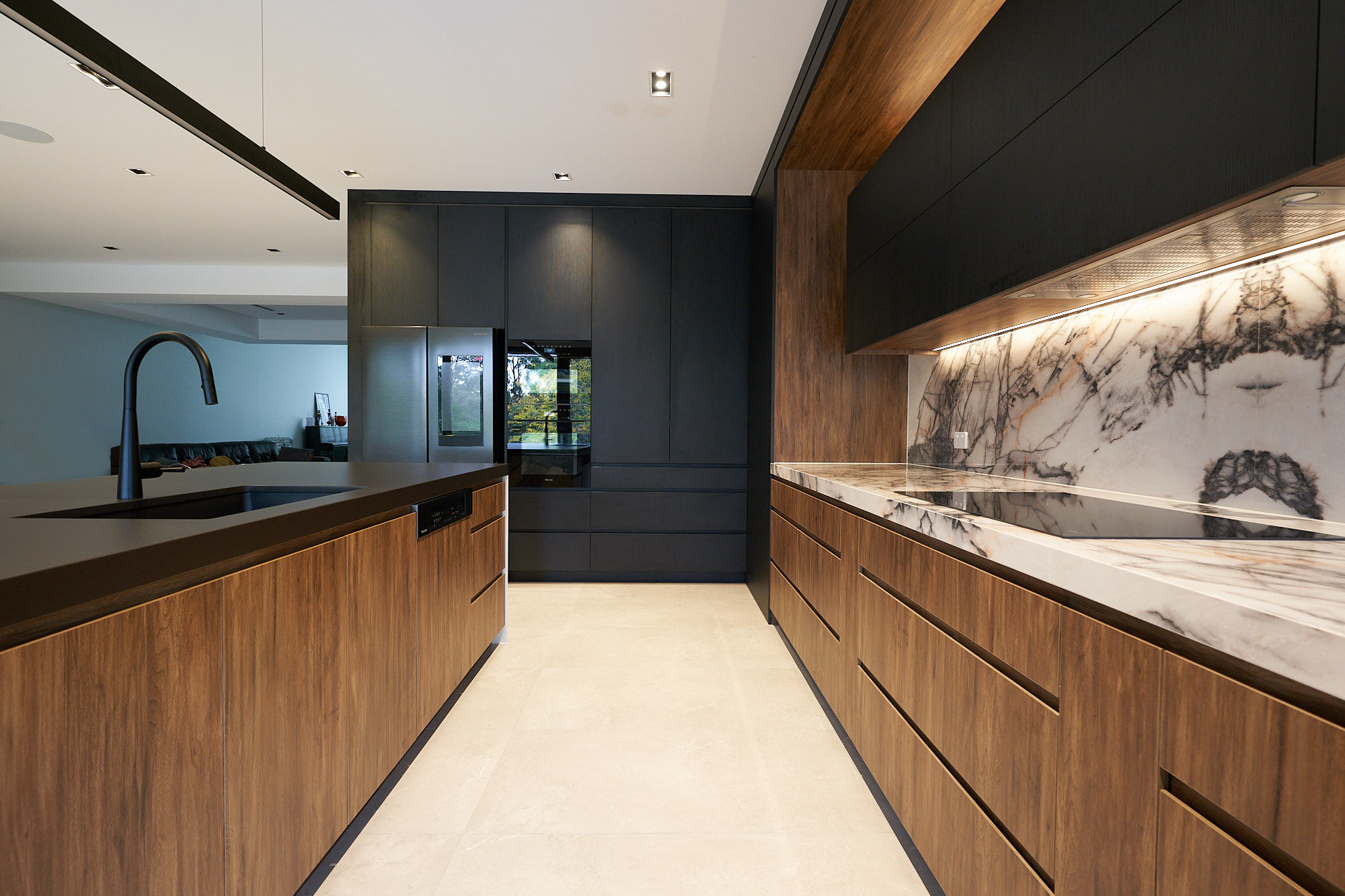 Flat black and timber custom kitchen with integrated appliances by Renolux Sydney