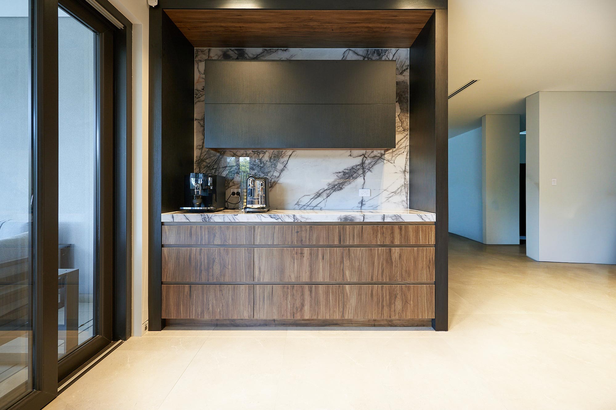 Flat black and timber kitchen with custom coffer bar joinery by Renolux