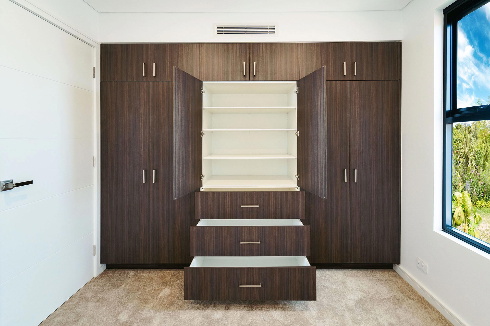 Dark brown custom wardrobe joinery by Renolux Sydney
